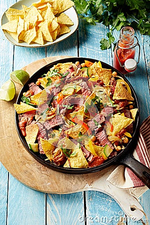 Delicious spicy beef entrecote and nachos Stock Photo