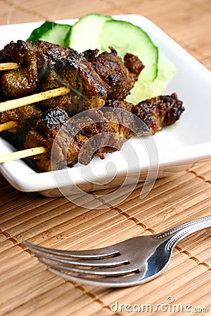 Delicious steaming satay Stock Photo