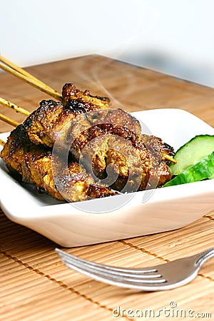 Delicious steaming satay Stock Photo
