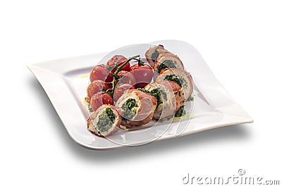 Delicious stuffed chicken roll decorated with roasted cherry tom Stock Photo