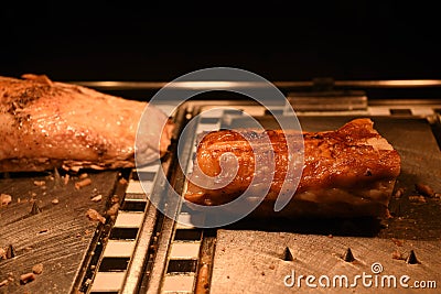 Succulent golden cooked roast pork belly and a joint of turkey Stock Photo