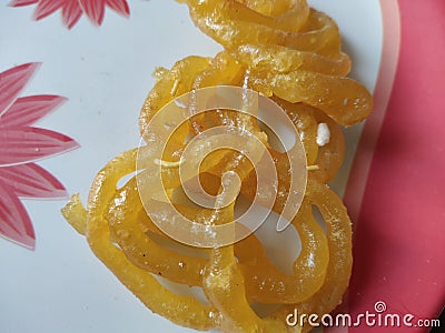 This is a delicious sweet jilebi, with yellow color,in the village of Ambegaon , Maharashtra, India. Stock Photo