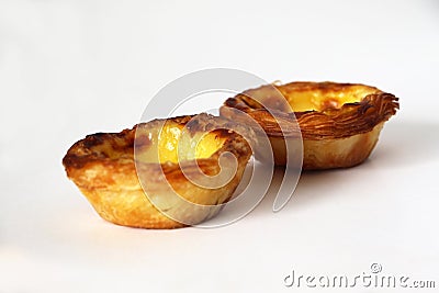 Traditional Portuguese custard pastry called a pasteis de nata isolated on white background Stock Photo