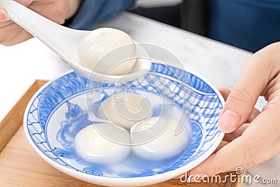 Delicious tang yuan, yuanxiao in a small bowl. Asian traditional festive food rice dumplings ball with stuffed fillings for Stock Photo