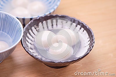 Delicious tang yuan, yuanxiao in a small bowl. Traditional festive food rice dumplings ball with stuffed fillings for Chinese Stock Photo