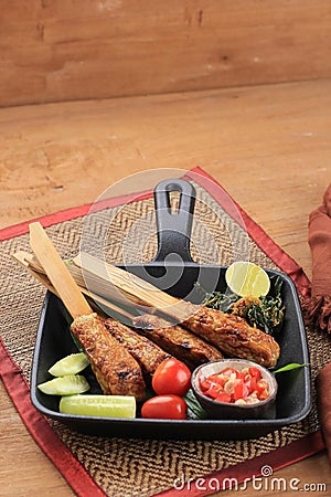 Delicious traditional Indonesian Balinese Culinary, Sate Lilit, Minced Seafood Satay Made from Tuna and other SpiceIingredients. Stock Photo