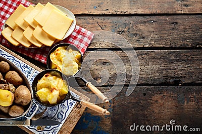 Delicious traditional Swiss melted raclette cheese Stock Photo