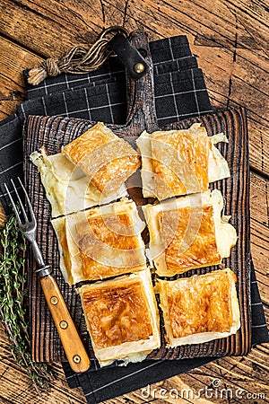 Delicious Turkish Tray pastry, Su boregi with cheese. Wooden background. Top view Stock Photo