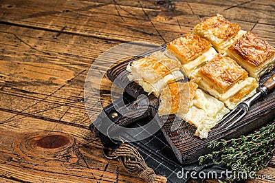 Delicious Turkish Tray pastry, Su boregi with cheese. Wooden background. Top view. Copy space Stock Photo