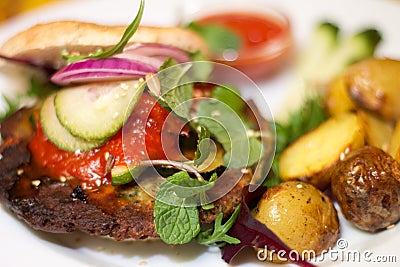 Delicious vegan burger on white plate Stock Photo