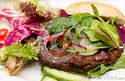 Delicious vegan burger on white plate Stock Photo