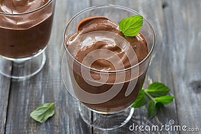 Ð¡hocolate mousse with banana, cocoa and mint in glasses Stock Photo