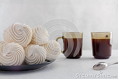 delicious zephyr on a plate standing on a light marble background. homemade desserts, pastry shop, pastry chef, holiday, birthday Stock Photo