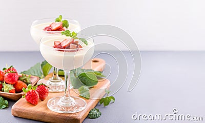 Delicous and nutritious double color colour strawberry desserts with mint and diced sarcocarp topping with airy blue Stock Photo