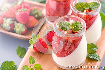 Delicous and nutritious double color colour strawberry desserts with mint and diced sarcocarp topping with airy blue Stock Photo