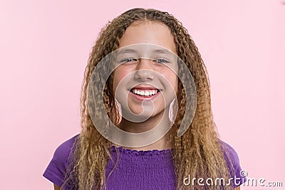 Delight, happiness, joy, victory, success and luck. Teen girl on a pink background. Facial expressions and people emotions concept Stock Photo