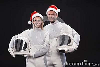 Delighted couple of cosmonauts are expressing amorousness Stock Photo