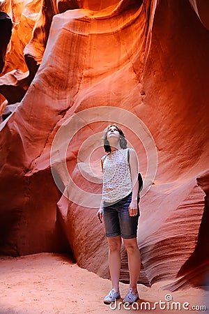 Delighted female tourist in Lower Antelope Canyon Stock Photo