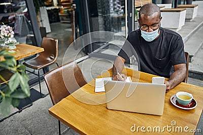 Delighted freelancer staring at screen of his gadget Stock Photo