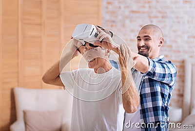 Delighted friends testing the virtual reality glasses Stock Photo