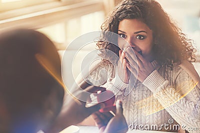 Delighted happy woman looking at the engagement ring Stock Photo