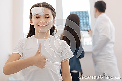 Delighted positive girl looking at you Stock Photo