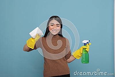 Delighted smiling and glad asian housemaid from daily routine Stock Photo