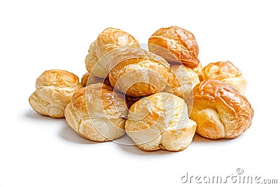 Delightful array of profiteroles showcasing smooth cream filling on a bright white surface Stock Photo