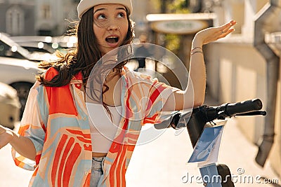 Delightful brown-haired woman of european appearance throw your gaze upward in fresh air. Stock Photo