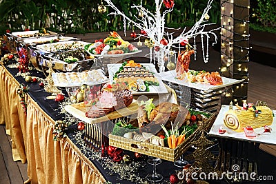 Delightful Christmas buffet with roasted chicken, beef, pork, se Stock Photo