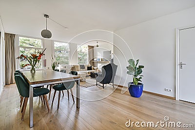 Delightful dining room with plush blue velvet chairs Stock Photo