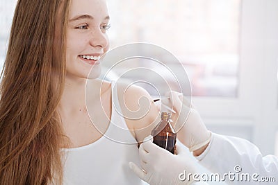 Delightful teenager consulting dermatologist in the clinic Stock Photo