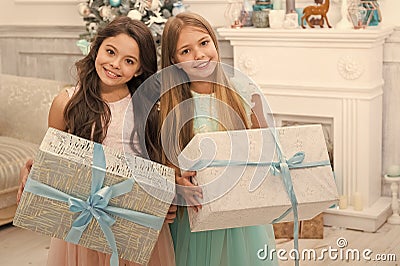 Delivery christmas gifts. happy new year. happy little girls sisters celebrate winter holiday. christmas time. Cute Stock Photo