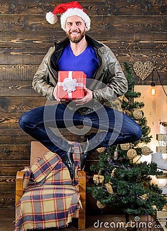 Delivery christmas present. Still have time. Delivery service. Gifts delivery. Man santa hat hurry to deliver gift on Stock Photo