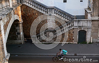 Delivery Cyclist runs fast Editorial Stock Photo