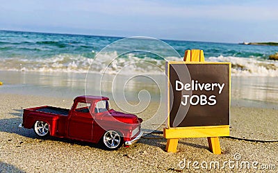 Delivery jobs available text on Black Board. Stock Photo