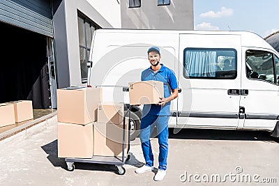 Delivery man with box Stock Photo