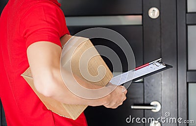 Delivery man at front door Stock Photo