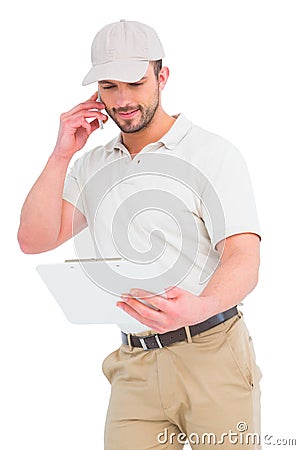 Delivery man talking on mobile phone Stock Photo