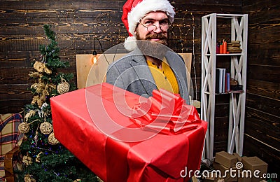 Delivery service. Christmas is coming. Santa courier. Gifts delivery. Man santa hat deliver gift. Spread happiness and Stock Photo