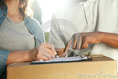 Delivery Service. Close Up Hands Signing Documents Stock Photo