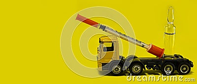 Delivery of vaccine against coronavirus, covid19, concept of medical rescue of the world from the virus to humans, yellow lorry Stock Photo