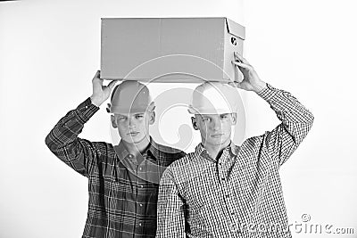 Delivery, warehouse and parcel concept. Men with serious faces Stock Photo