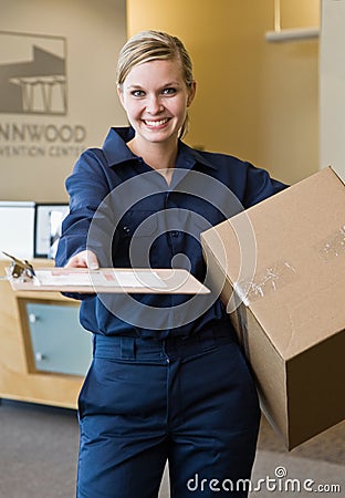 Delivery woman presenting shipping receipt Stock Photo