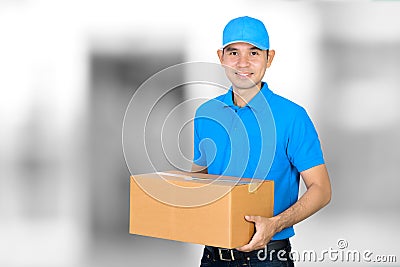 Deliveryman holding a cardboard parcel box Stock Photo