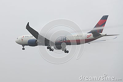 Delta Air Lines Airbus A330-900 landing with wake vortex visible Editorial Stock Photo