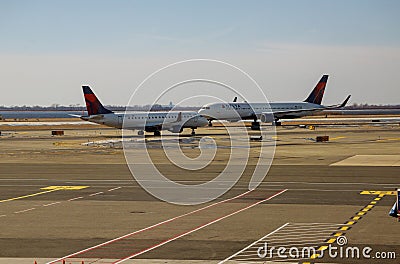 Delta Airlines jet planes, airport terminal gates Servicing F. Kennedy International Airport. Delta Airlines Editorial Stock Photo