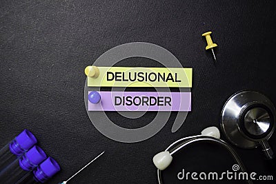 Delusional Disorder text on Sticky Notes. Top view isolated on black background. Healthcare/Medical concept Stock Photo