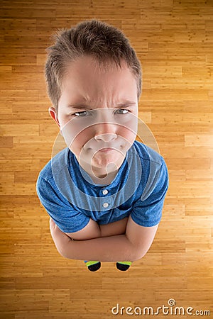 Demanding Young Boy Looking at the Camera Stock Photo