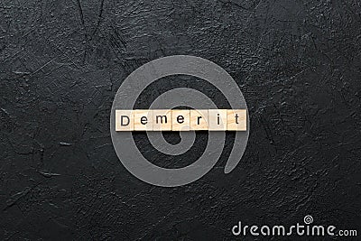 demerit word written on wood block. demerit text on table, concept Stock Photo